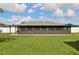 View of the spacious enclosed patio that overlooks the backyard at 8219 Rangers Path, Lakeland, FL 33809