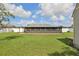 View of the spacious enclosed patio that overlooks the backyard at 8219 Rangers Path, Lakeland, FL 33809