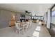 Spacious sunroom with lots of natural light, ceiling fans, neutral flooring, and a dining/living area at 8219 Rangers Path, Lakeland, FL 33809