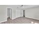Spacious bedroom features wood-look flooring and includes an ensuite bathroom with a shower and closet at 1025 Lakewood Ct, Lakeland, FL 33801