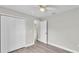 Comfortable bedroom with wood floors, a ceiling fan and a large closet at 1025 Lakewood Ct, Lakeland, FL 33801