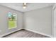 Cozy bedroom with a ceiling fan, window and closet, perfect for relaxation at 1025 Lakewood Ct, Lakeland, FL 33801