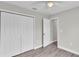 Bedroom with a ceiling fan, large closet, and wood floors, creating a comfortable space at 1025 Lakewood Ct, Lakeland, FL 33801