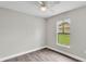 Bedroom with a window and wood floors, providing a serene and peaceful atmosphere at 1025 Lakewood Ct, Lakeland, FL 33801