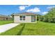 Charming single-story home featuring a well-manicured lawn and a freshly painted exterior at 1025 Lakewood Ct, Lakeland, FL 33801