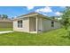 Charming single-story home with a modern front porch, fresh grass, and light-colored paint at 1025 Lakewood Ct, Lakeland, FL 33801