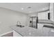 Modern kitchen with granite countertops, stainless steel appliances, and ample cabinet space at 1025 Lakewood Ct, Lakeland, FL 33801