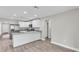 Open concept kitchen with stainless steel appliances and a breakfast bar at 1025 Lakewood Ct, Lakeland, FL 33801