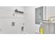 Bright laundry area with a white shelf, water heater, electrical panel, and hookups at 1025 Lakewood Ct, Lakeland, FL 33801