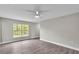 Bright living room featuring modern floors, neutral paint, and natural light from a large window at 1025 Lakewood Ct, Lakeland, FL 33801