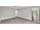 Spacious living room with modern floors, light-colored walls, and a ceiling fan at 1025 Lakewood Ct, Lakeland, FL 33801