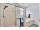 Bright bathroom features a separate shower and tub, as well as towel racks and modern fixtures at 2472 Tahoe Dr, Lakeland, FL 33805
