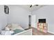 Bedroom featuring wood-look flooring, view of closet, and a white day bed at 2472 Tahoe Dr, Lakeland, FL 33805