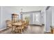 Formal dining room with elegant chandelier, wood floors, and seating for eight at 2472 Tahoe Dr, Lakeland, FL 33805