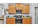 Well-lit kitchen features stainless steel appliances and light wood cabinetry providing a bright, modern feel at 2472 Tahoe Dr, Lakeland, FL 33805