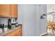 Open kitchen nook features a modern coffee station with natural light entering from the nearby dining area at 2472 Tahoe Dr, Lakeland, FL 33805
