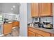 Kitchen nook shows ample counter space with a coffee station and modern appliances on wood-look floors at 2472 Tahoe Dr, Lakeland, FL 33805