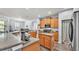 Bright kitchen featuring wooden cabinetry, a center island, and modern appliances at 2472 Tahoe Dr, Lakeland, FL 33805