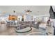 Spacious living area with modern decor, wood flooring, and seamless flow to other rooms at 2472 Tahoe Dr, Lakeland, FL 33805