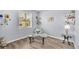 Cozy sitting room with plush chair, glass coffee table and decorative shelving at 2472 Tahoe Dr, Lakeland, FL 33805