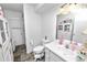 Practical bathroom with sink, toilet and tiled floor at 2700 Park Ave, Indian Lake Estates, FL 33855