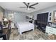 View of the bedroom with fan, desk, and full size bed at 2700 Park Ave, Indian Lake Estates, FL 33855