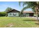 Charming single-story home with a well-maintained lawn and mature landscaping at 2700 Park Ave, Indian Lake Estates, FL 33855