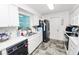 Efficient kitchen with sleek appliances and plenty of counter space at 2700 Park Ave, Indian Lake Estates, FL 33855