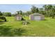 View of the two sheds in the backyard at 2700 Park Ave, Indian Lake Estates, FL 33855