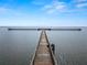 Wooden pier stretching into a vast lake at 2700 Park Ave, Indian Lake Estates, FL 33855