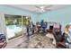 Spacious sun room offering serene views of the backyard and pool at 2700 Park Ave, Indian Lake Estates, FL 33855
