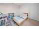 Cozy bedroom with desk, bookcase, and twin bed, suitable for a room or guest room at 2811 Grandbury Grove, Lakeland, FL 33811