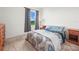 Cozy bedroom featuring a comfortable bed, matching nightstands, and neutral tones for relaxation at 2811 Grandbury Grove, Lakeland, FL 33811