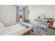Neat bedroom with comfortable bed, a view from the window, and decoratively-designed rug at 2811 Grandbury Grove, Lakeland, FL 33811