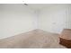 Well-lit bedroom with neutral carpet, white doors, and a corner dresser at 2811 Grandbury Grove, Lakeland, FL 33811
