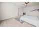 Spacious bedroom with a soft carpet and a blue wave decoration on the wall at 2811 Grandbury Grove, Lakeland, FL 33811