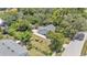Aerial view of a home with large yard, detached garage and a neighboring home at 423 Avenue H Se, Winter Haven, FL 33880