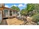 Backyard deck with seating area and view of detached garage at 423 Avenue H Se, Winter Haven, FL 33880