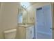 Small bathroom with granite-look vanity and open doorway at 5298 Tennessee Ridge Ct, Auburndale, FL 33823