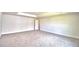 Large carpeted bedroom with tray ceilings offers ample space for relaxation and personalization at 5298 Tennessee Ridge Ct, Auburndale, FL 33823
