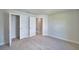 Bedroom view with carpeted floors, neutral walls, and white doors to closet and hallway at 5298 Tennessee Ridge Ct, Auburndale, FL 33823