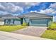 Beautiful single-story home with brick paver driveway and manicured front lawn at 5298 Tennessee Ridge Ct, Auburndale, FL 33823