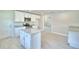Bright kitchen features white cabinets, stainless steel appliances, and granite countertops at 5298 Tennessee Ridge Ct, Auburndale, FL 33823