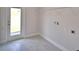 Laundry room featuring tile floors and outdoor access at 5298 Tennessee Ridge Ct, Auburndale, FL 33823