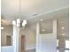 Bright living room showcasing modern lighting fixtures and neutral paint tones at 5298 Tennessee Ridge Ct, Auburndale, FL 33823