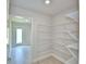Walk-in pantry with wire shelving and ample storage space at 5298 Tennessee Ridge Ct, Auburndale, FL 33823