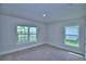 This bedroom offers natural light and scenic views from the large window at 5427 Waterside Dr, Auburndale, FL 33823