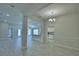 Spacious open-concept living area with tile floors and ample natural light at 5427 Waterside Dr, Auburndale, FL 33823