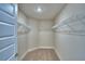 Walk-in closet with wire shelving and carpeted floor offers storage at 5427 Waterside Dr, Auburndale, FL 33823