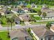 Single-Gathering home in a lakeside community featuring well-kept lawns and attractive landscaping at 5611 Aral Dr, Lakeland, FL 33805